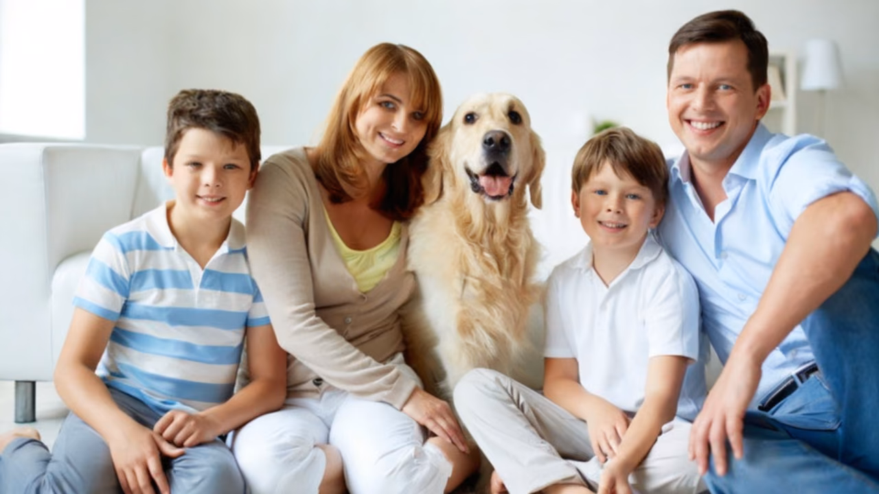 Family on the sofa with their golden retriever, ESA letter in Albuquerque, NM