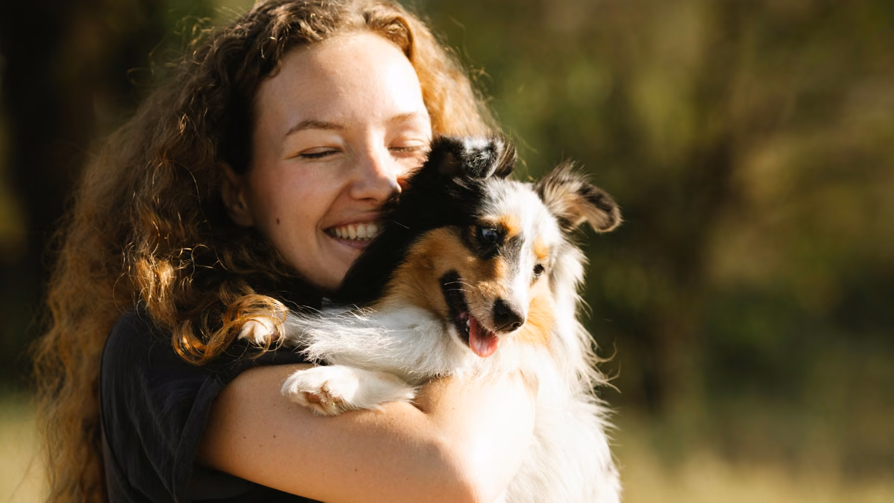 Woman hugging her Australian shepherd, ESA letter in Bakersfield, CA