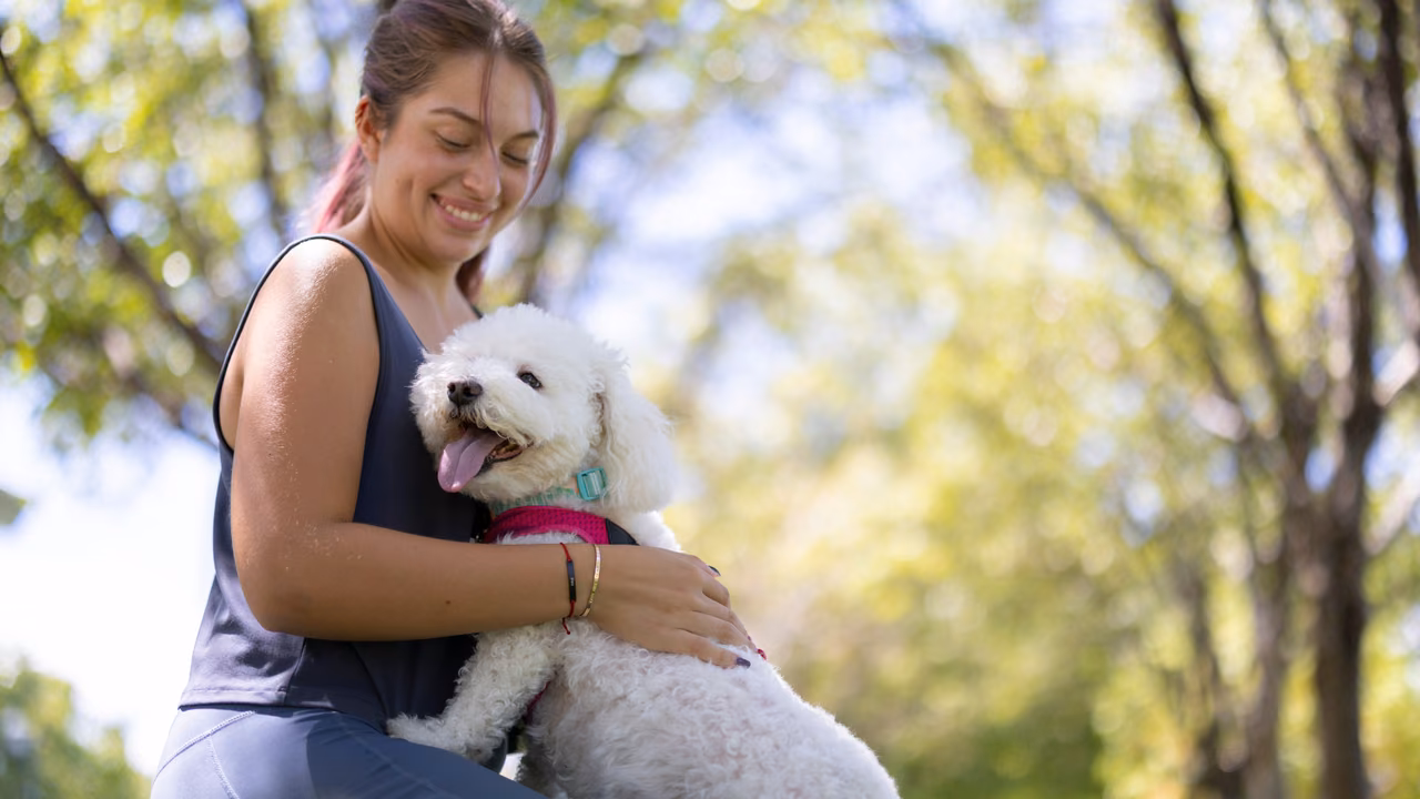 Woman hugging her poodle in a park, ESA letter in El Paso, TX