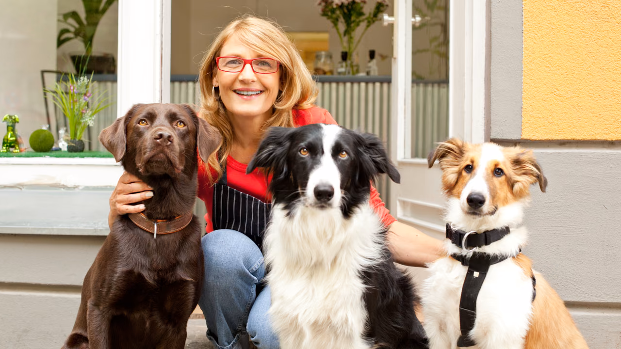 Woman sitting on her porch with three dogs, ESA letter in Lincoln, NE