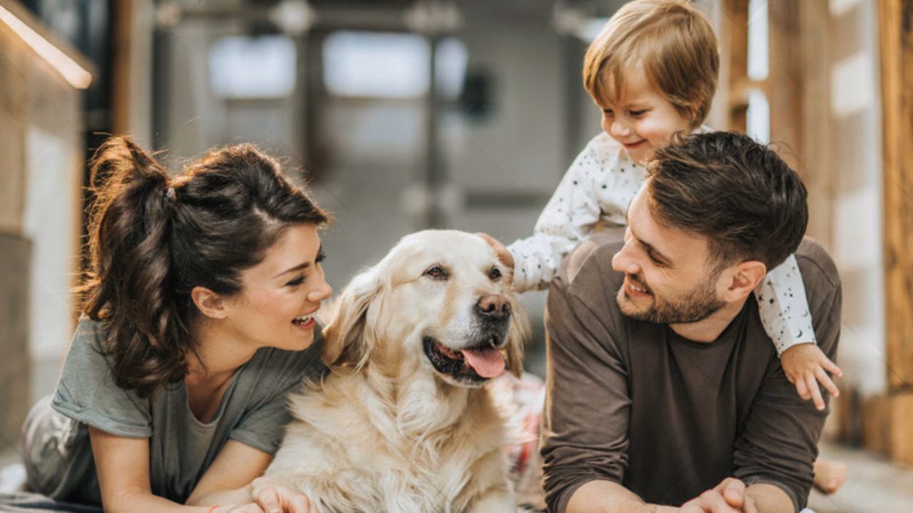 Family lying on the floor with their golden retriever, ESA letter in Michigan