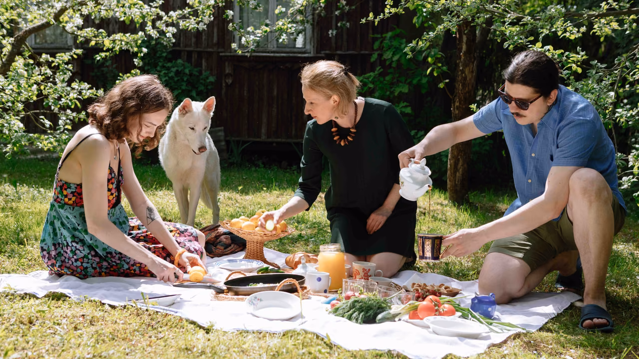 Friends having a picnic with a white dog, ESA letter in Milwaukee, WI