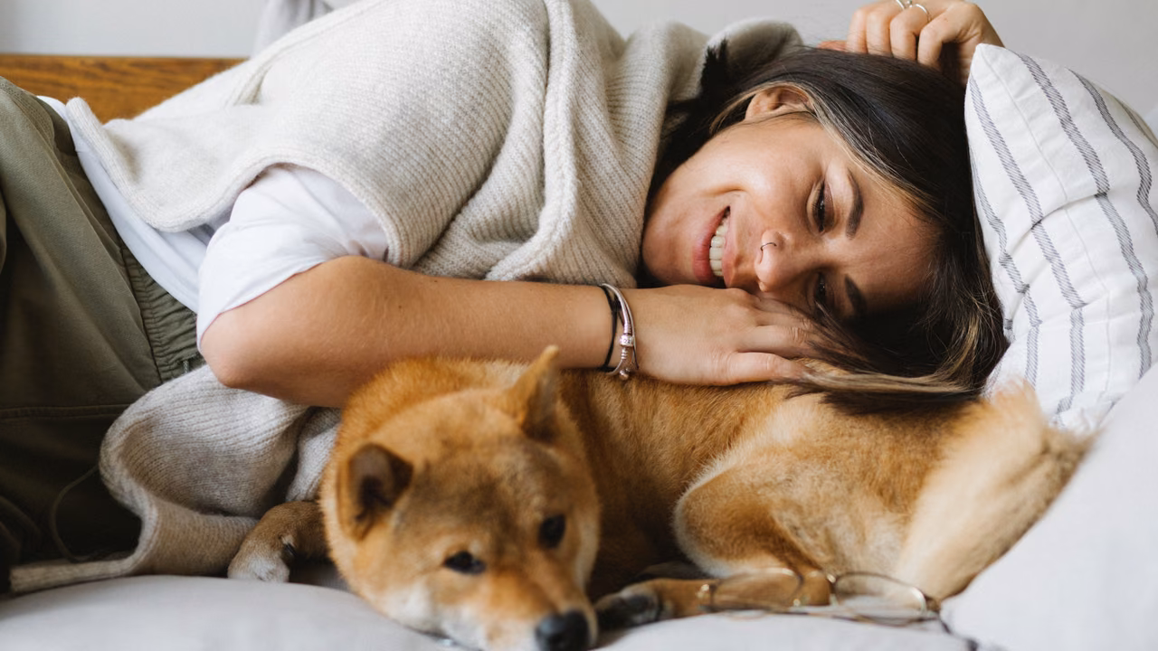 Woman napping with her Shiba Inu, ESA letter in Missouri