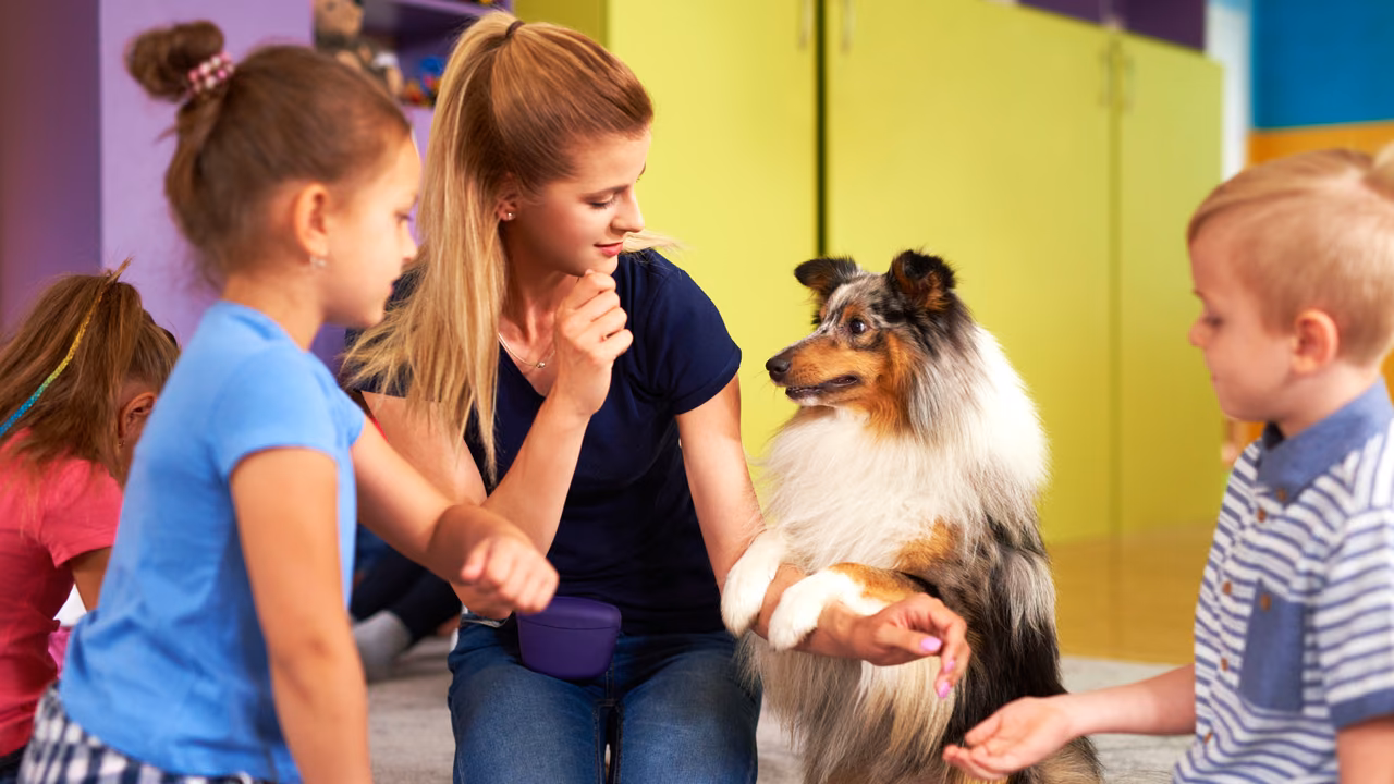 Teacher and children with a sheltie in a classroom, ESA letter in Montgomery, AL