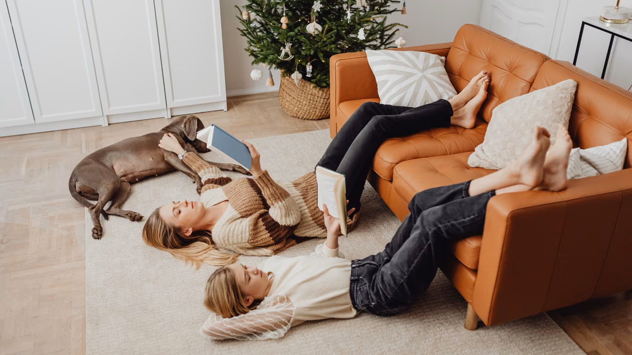 Family relaxing on the living room floor with their dog, ESA letter in Nevada