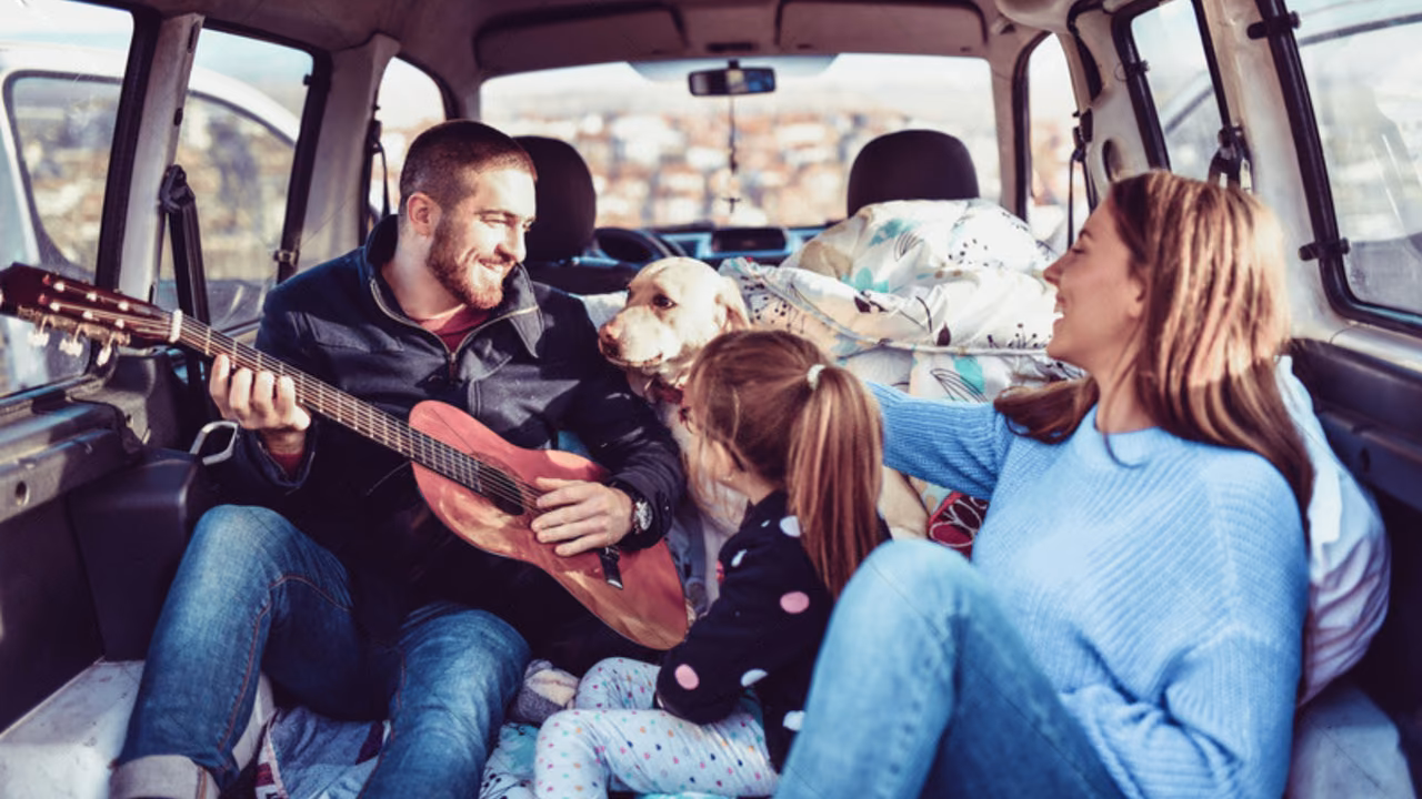 Family playing guitar with their dog in a camper van, ESA letter in New Hampshire