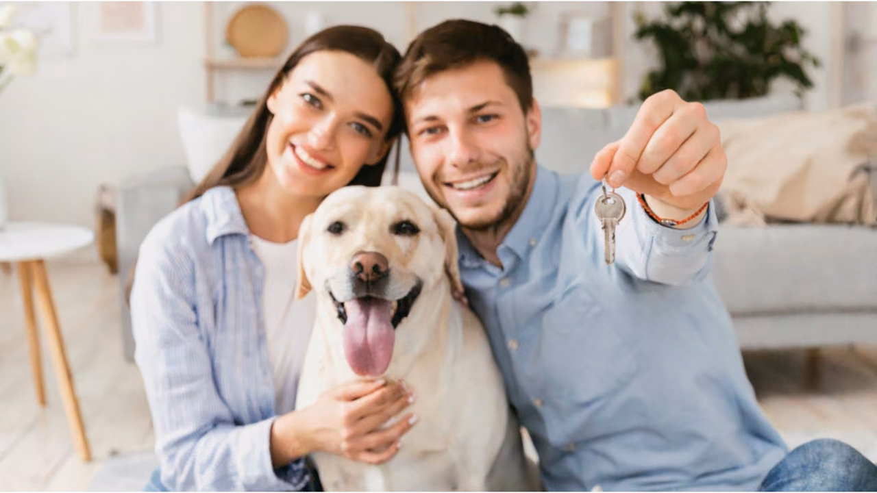 Couple holding the keys to their new home with their Labrador, ESA letter in New Jersey