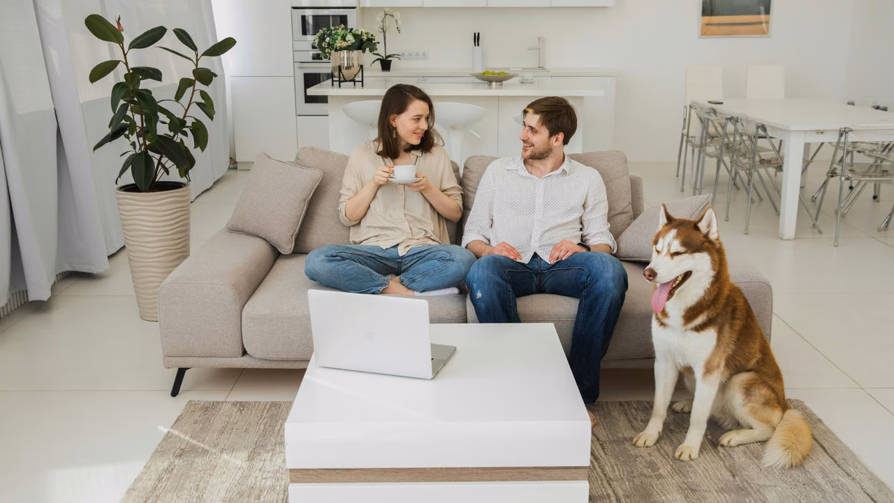 Couple on the sofa with their husky, ESA letter in Omaha, NE