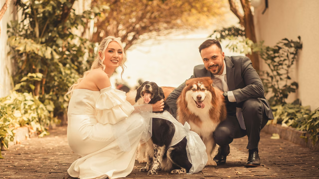 Couple posing with their two dogs in a garden, ESA letter in Raleigh, NC